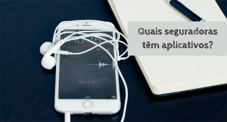 Imagem de um smartphone e um caderno em cima de uma mesa com a descrição: quais seguradoras tem aplicativos?